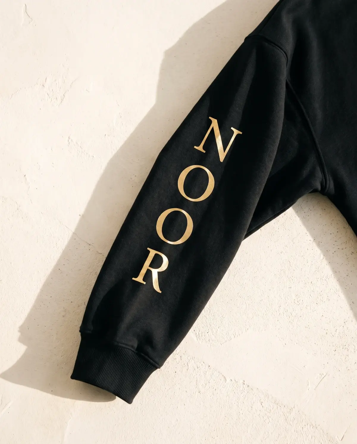 The Power of Noor · Black · Sleeve