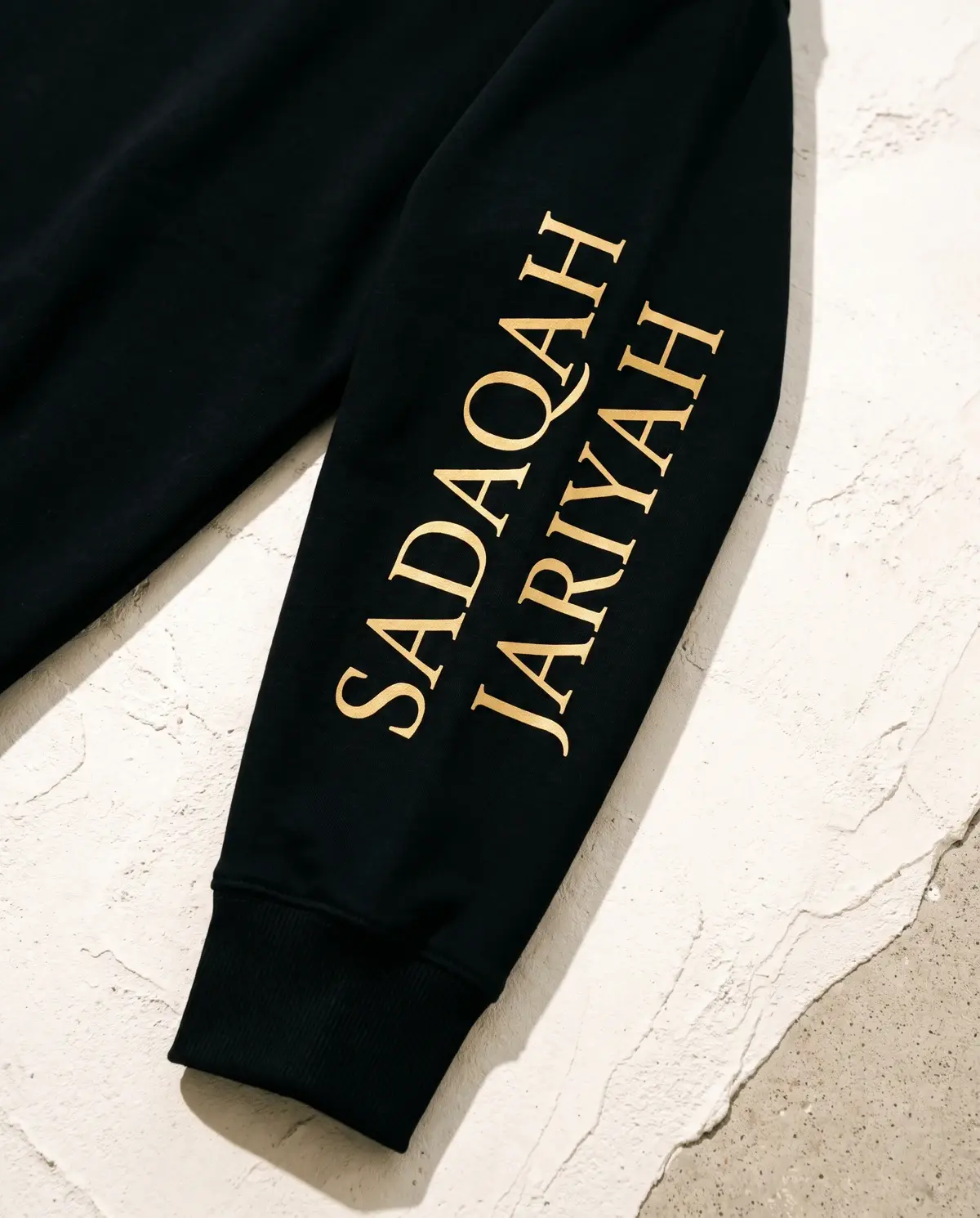 The Power of Sadaqah Jariyah · Black · Sleeve