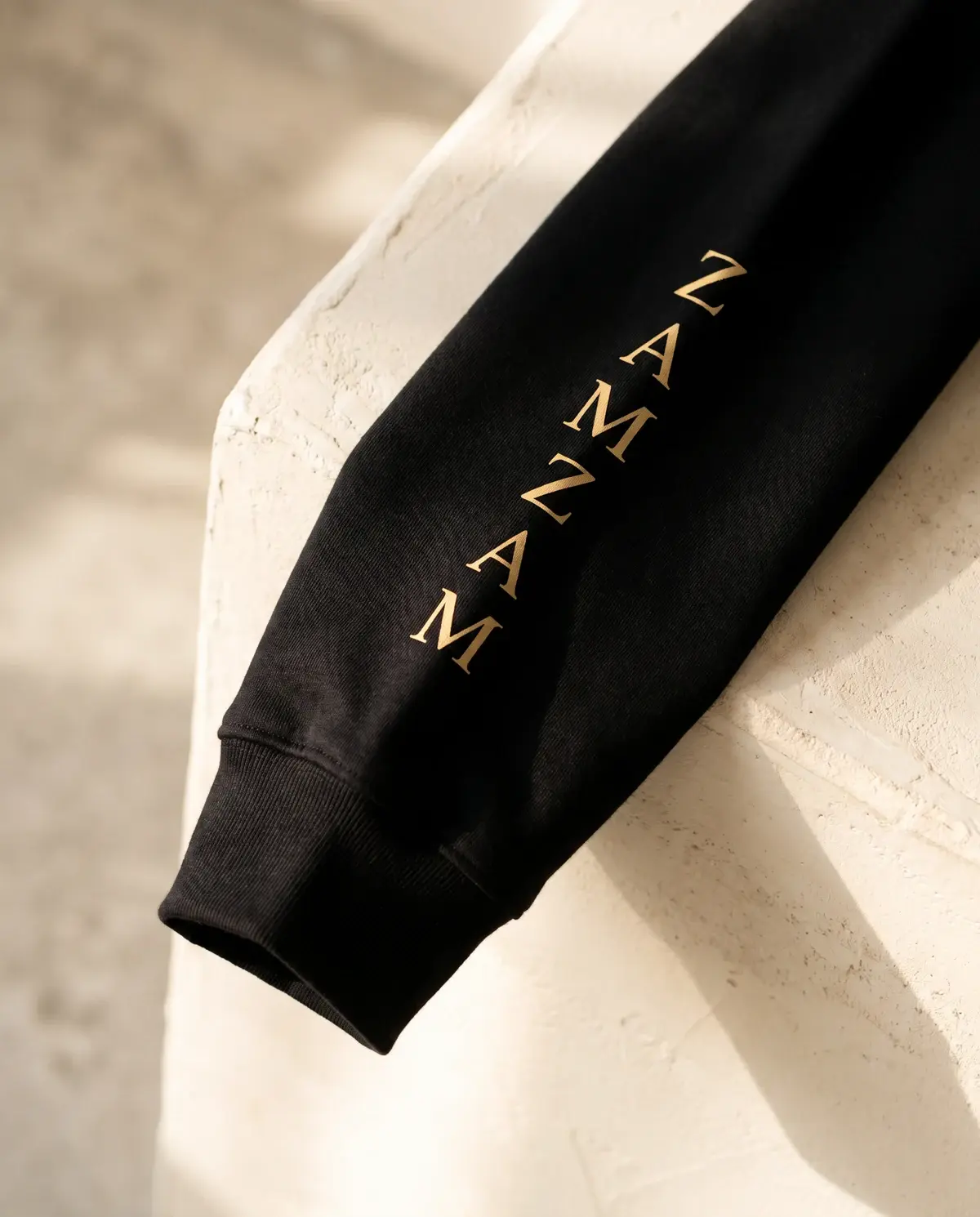 The Power of Zamzam · Black · Sleeve